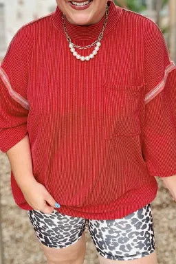 Doodlations Coffee Bar & Boutique fiery red ribbed tunic blouse with round neck, bracelet sleeves, and chest pocket.