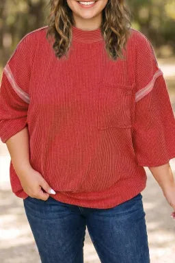 Doodlations Coffee Bar & Boutique fiery red ribbed tunic with bracelet sleeves, round neck, and chest pocket.