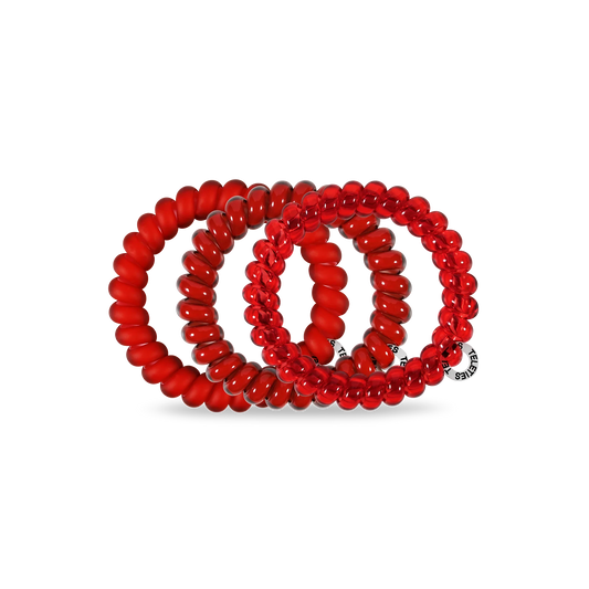 Doodlations Coffee Bar & Boutique red spiral hair ties with a strong, damage-free grip and stylish bracelet design.