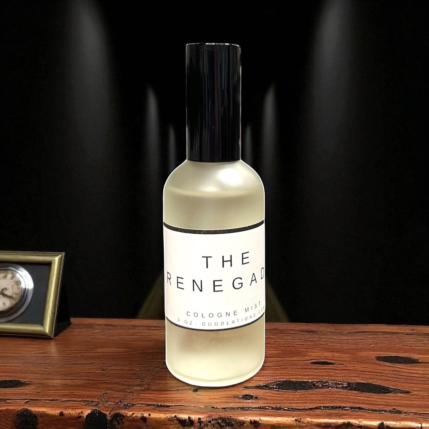 Doodlations Coffee Bar & Boutique The Renegade fine mist cologne in a sleek frosted glass bottle on a wooden table
