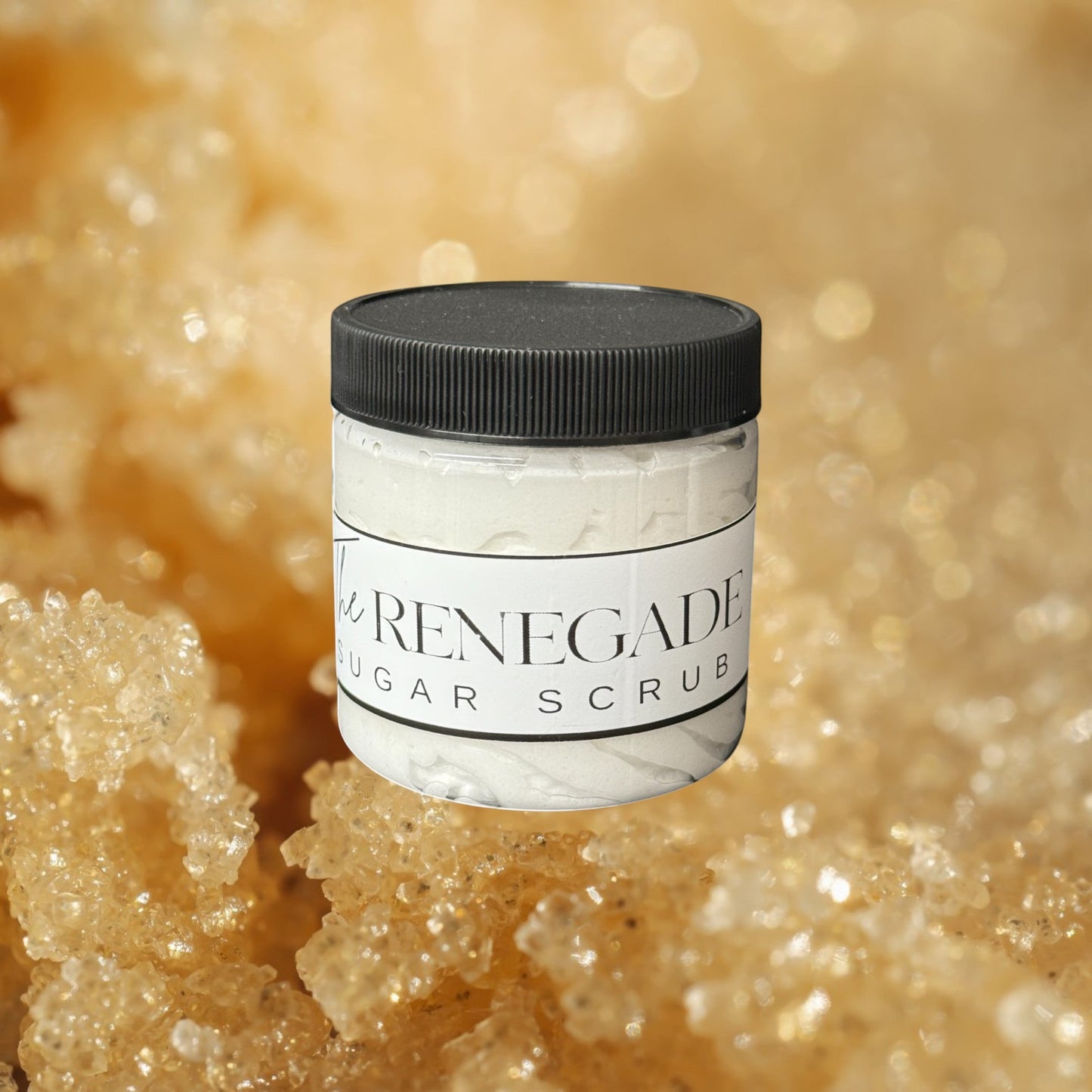 Doodlations Coffee Bar & Boutique The Renegade Men's Sugar Scrub in a clear jar with a black lid. White textured scrub inside.