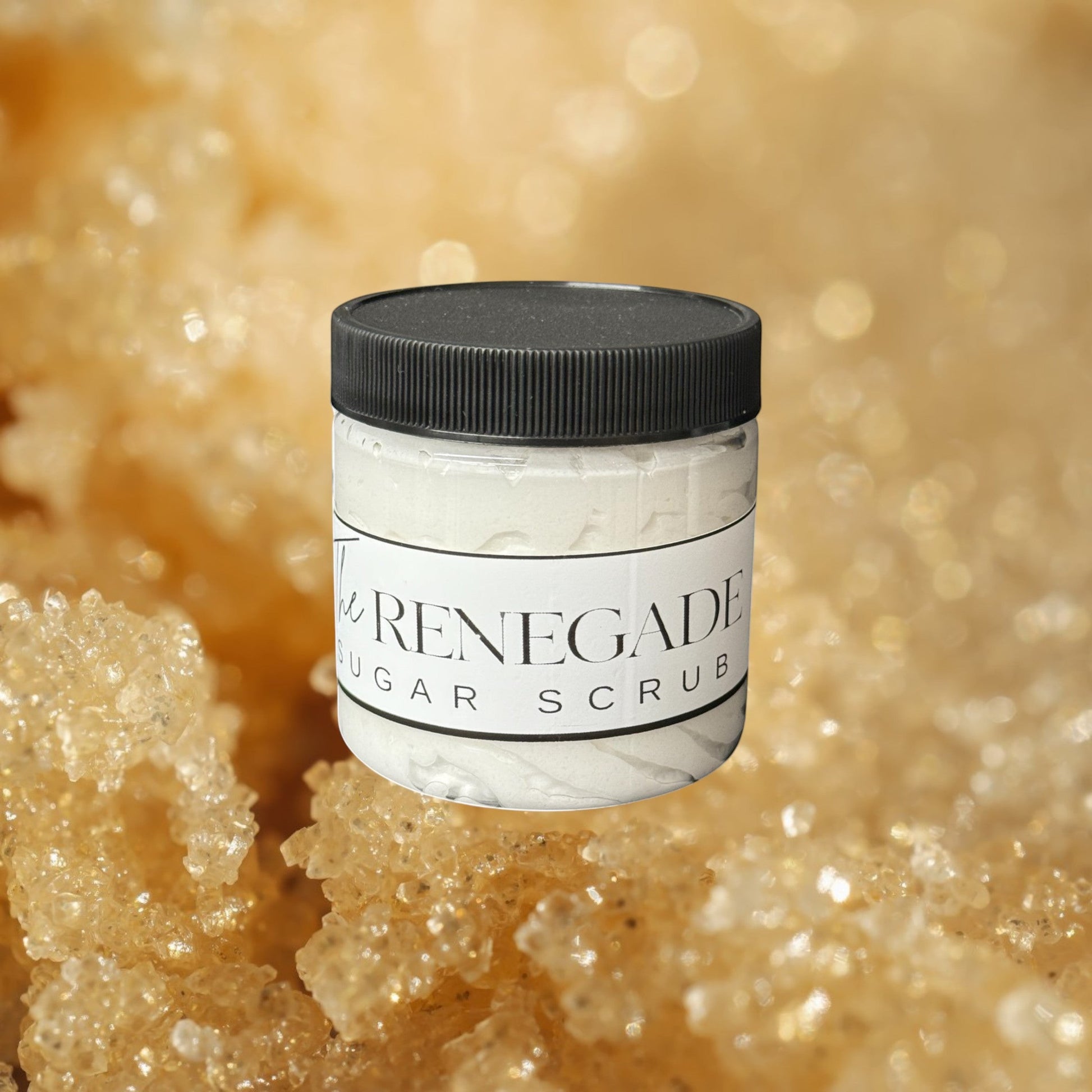 Doodlations Coffee Bar & Boutique The Renegade Men's Sugar Scrub in a clear jar with a black lid. White textured scrub inside.