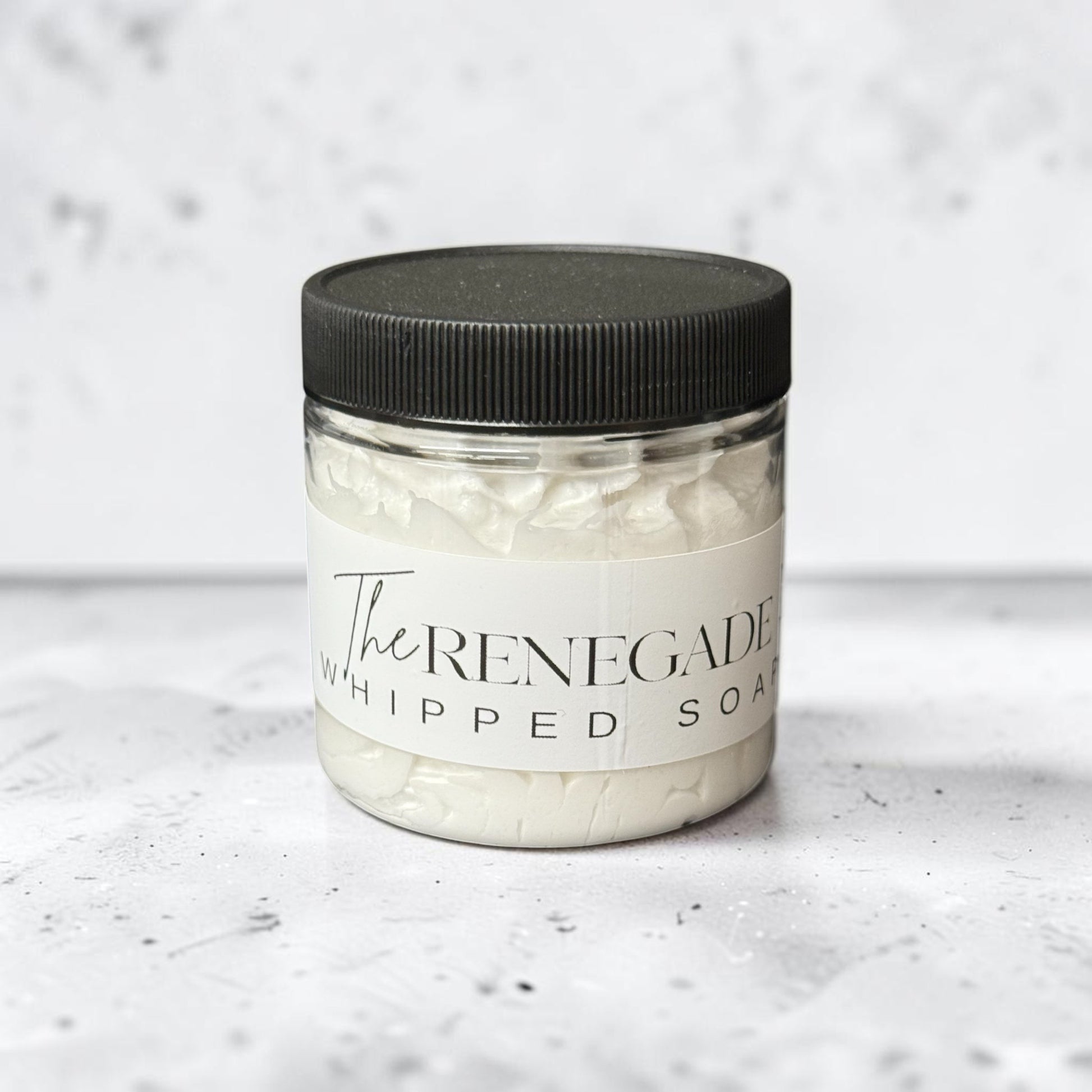 Doodlations Coffee Bar & Boutique The Renegade whipped soap in a 4 oz jar with a black lid and white label.