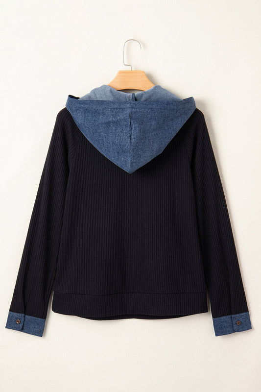Doodlations Coffee Bar & Boutique black ribbed knit long sleeve pullover with a blue denim hood and matching cuffs.