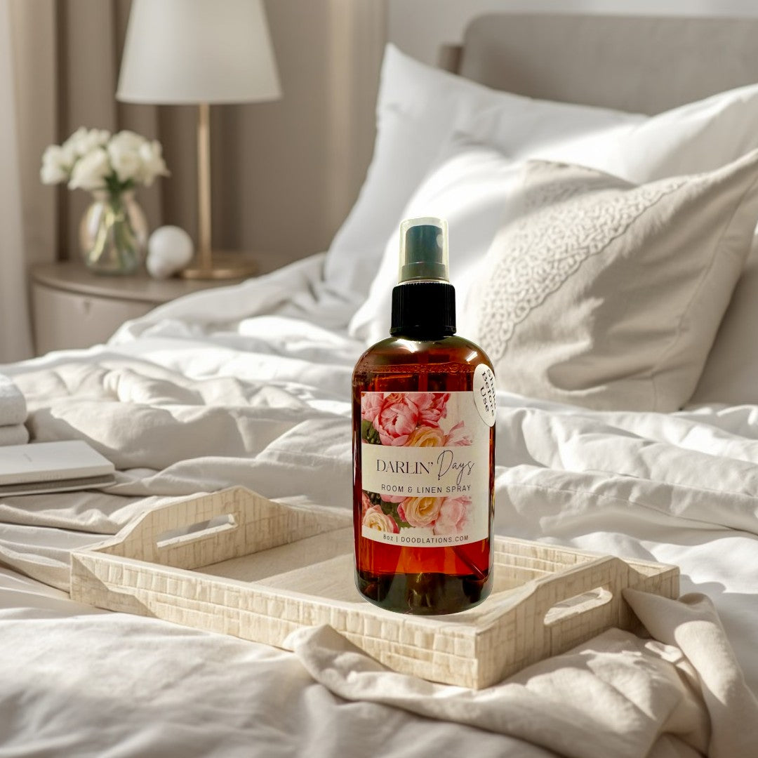 Doodlations Coffee Bar & Boutique Darlin' Days Room & Linen Spray with floral label. Amber glass bottle with spray top.