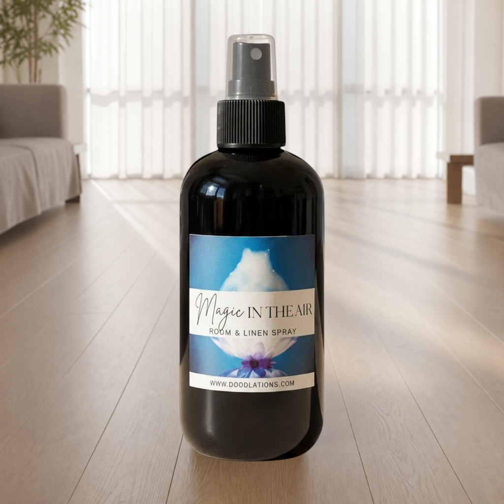 Doodlations Coffee Bar & Boutique Magic in the Air room and linen spray in a black bottle with a floral label