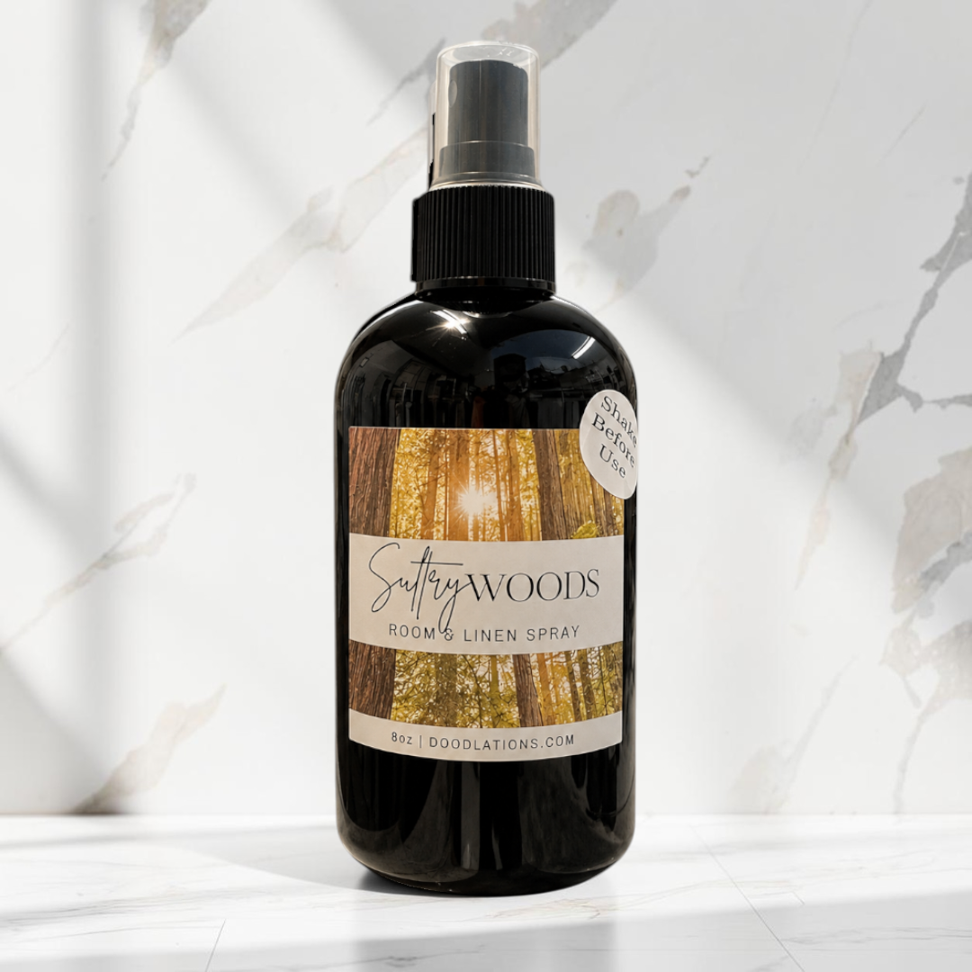Doodlations Coffee Bar & Boutique Autumn Flannel luxury room and linen spray in a black bottle on a marble surface