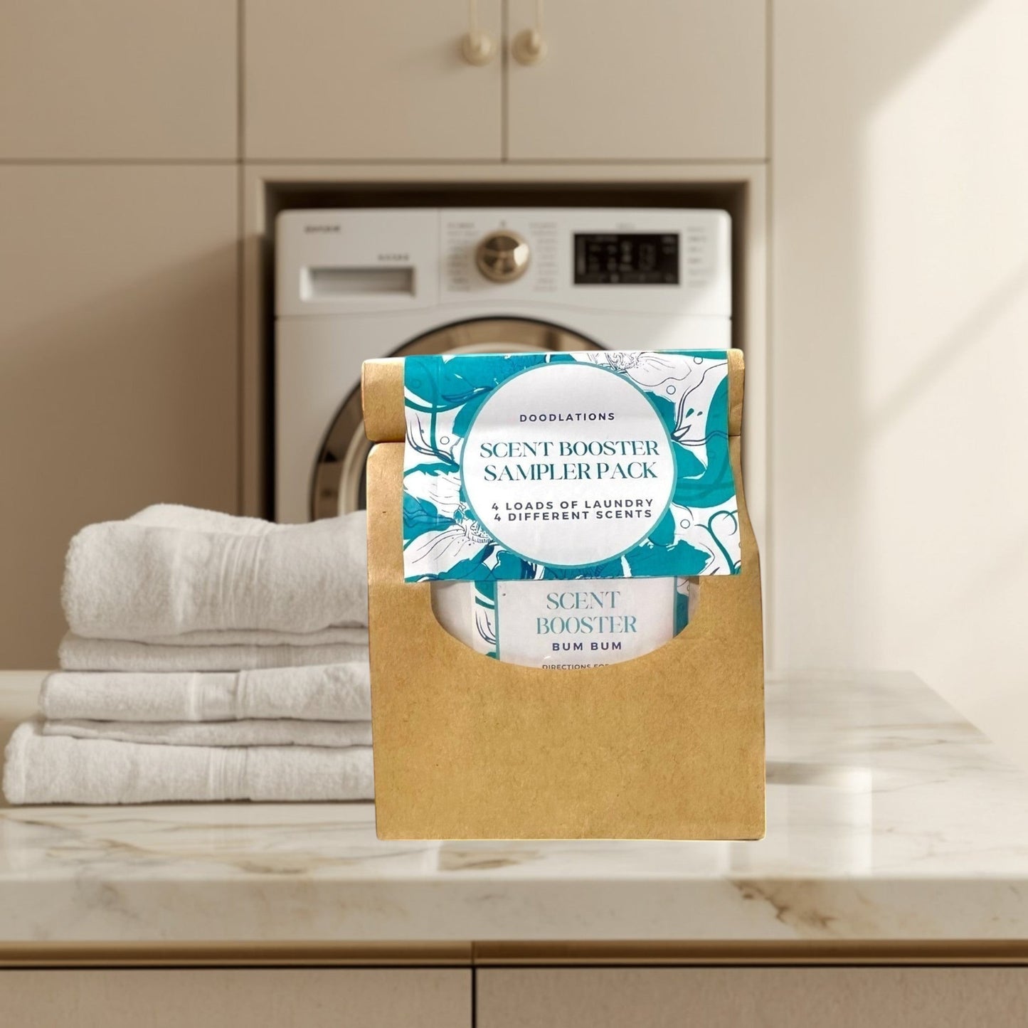 Doodlations Coffee Bar & Boutique Scent Booster Sampler Pack with 4 different laundry scents in a brown paper holder.