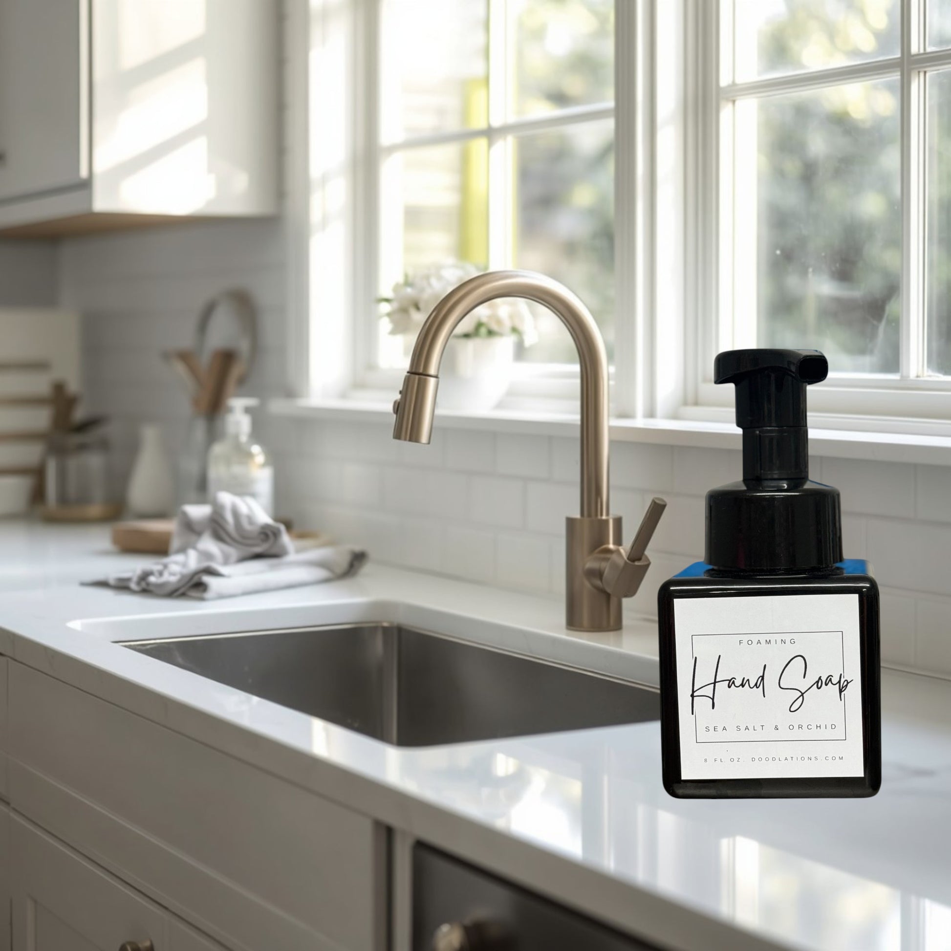 Doodlations Sea Salt & Orchid foaming hand soap in a black square bottle with a white label.