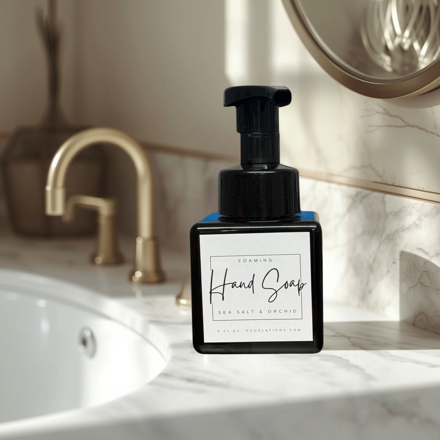 Doodlations Sea Salt & Orchid foaming hand soap in a black square bottle with a white label.
