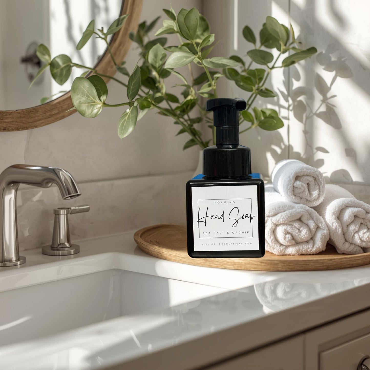 Doodlations Coffee Bar & Boutique Sea Salt & Orchid foaming hand soap in a black square bottle with a white label.