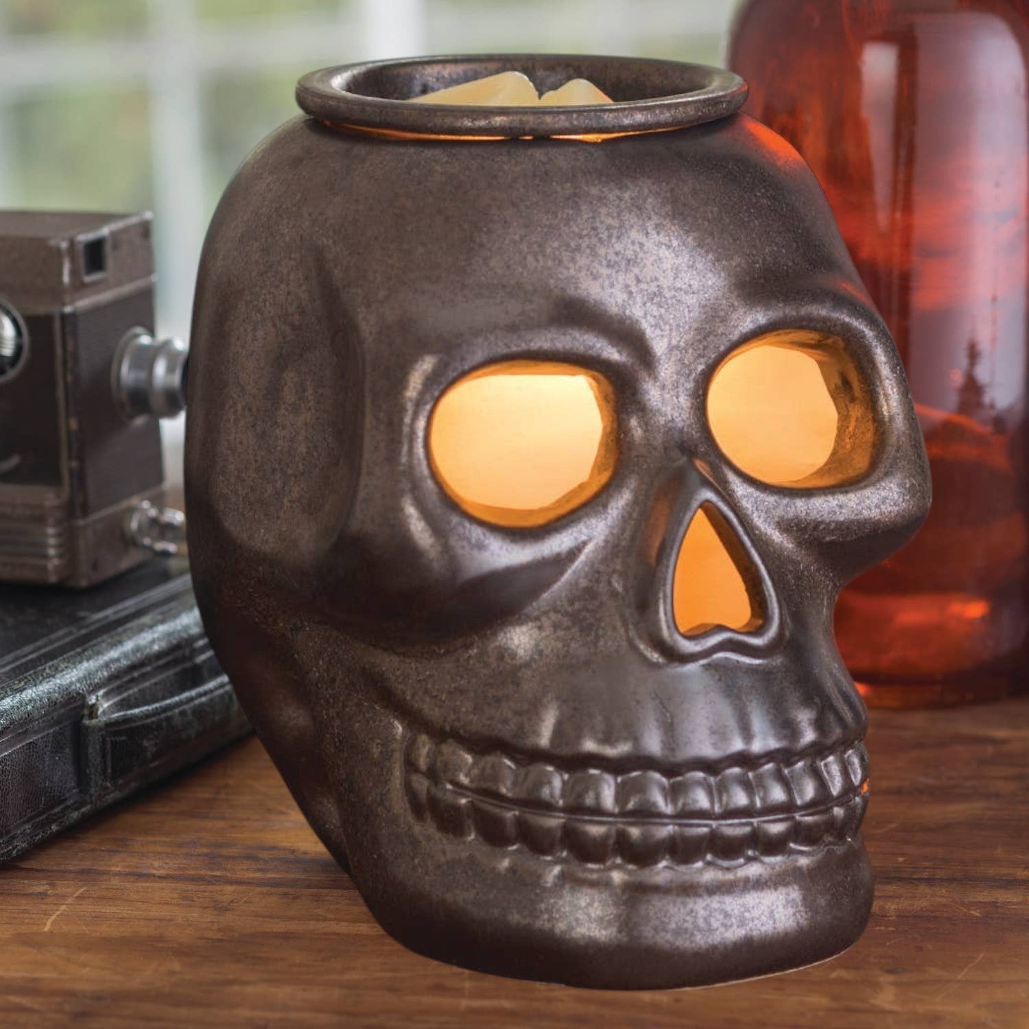 Doodlations Coffee Bar & Boutique gunmetal skull fragrance warmer with glowing eyes and nose for gothic home decor
