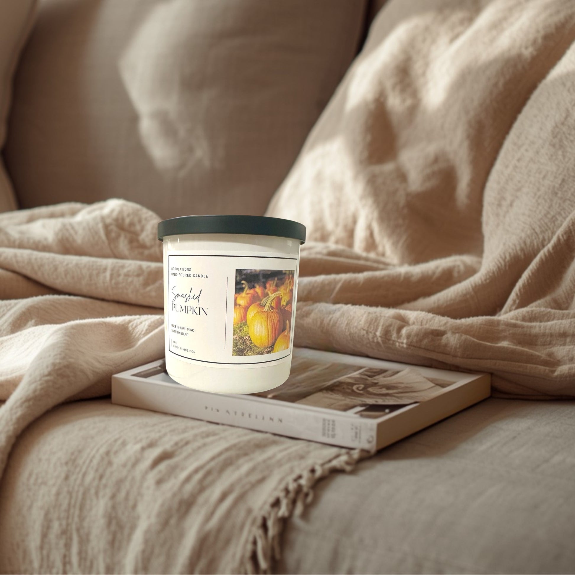 Doodlations Coffee Bar & Boutique Smashed Pumpkin hand-poured soy blend candle with a dark green lid.