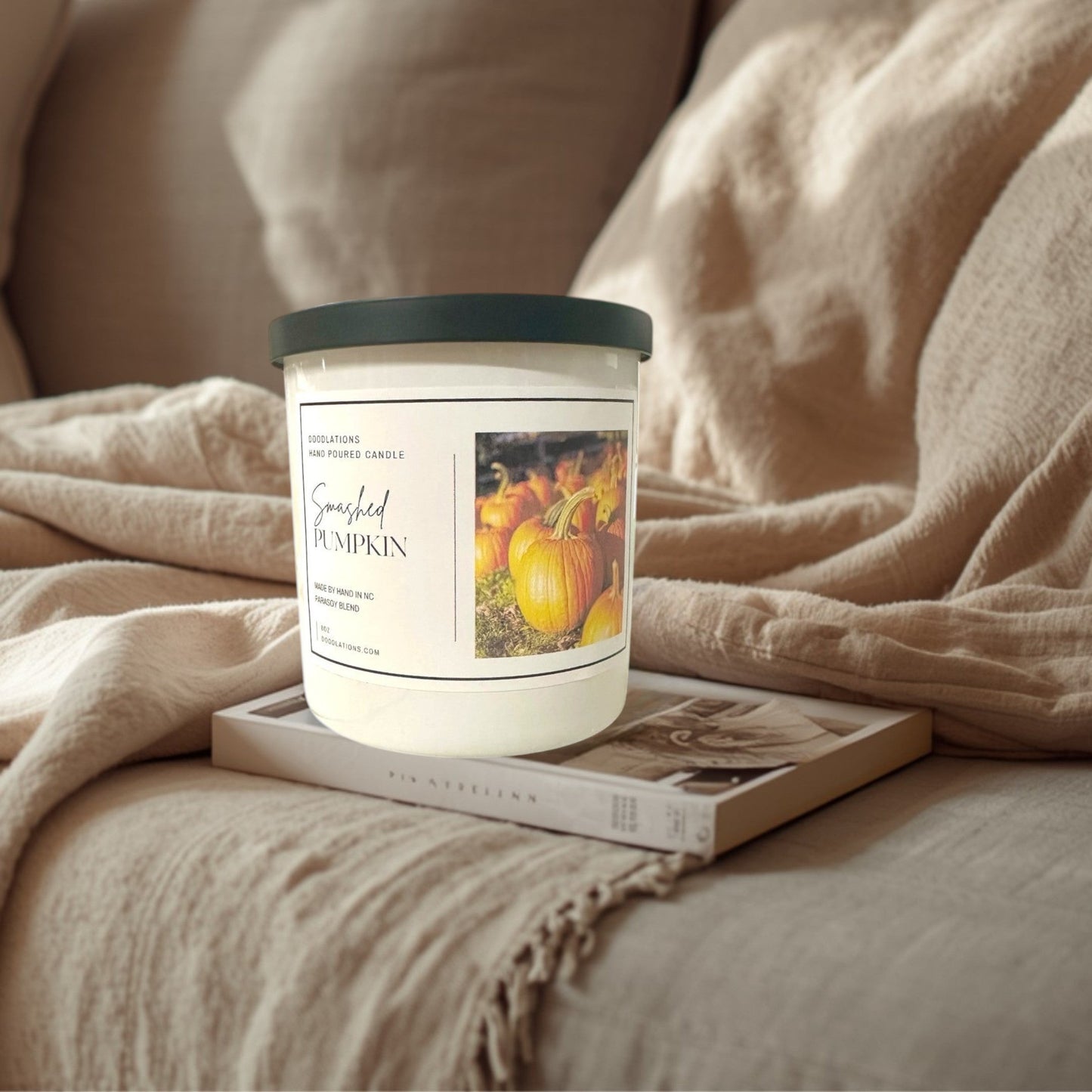 Doodlations Coffee Bar & Boutique Smashed Pumpkin hand-poured soy blend candle with a dark green lid.