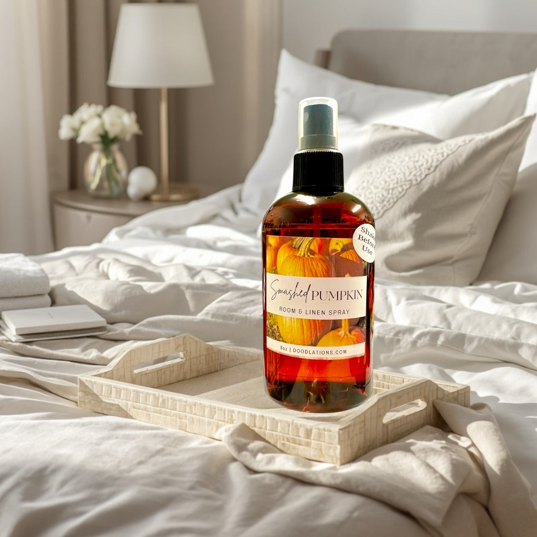 Doodlations Coffee Bar & Boutique Smashed Pumpkin Room & Linen Spray in amber bottle with pumpkin label. 8oz.