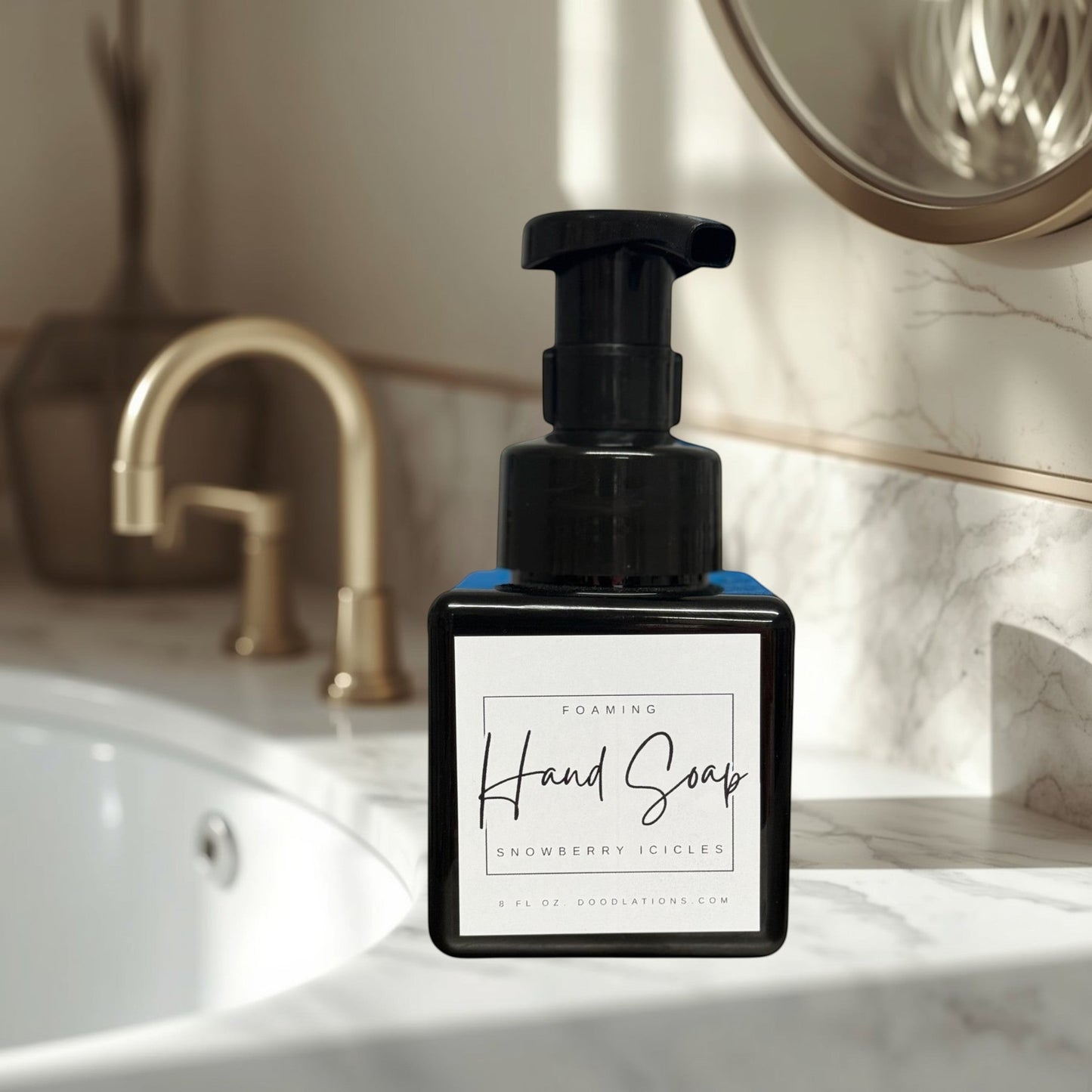 Doodlations Coffee Bar & Boutique Snowberry Icicles foaming hand soap in a black pump bottle with a white label.