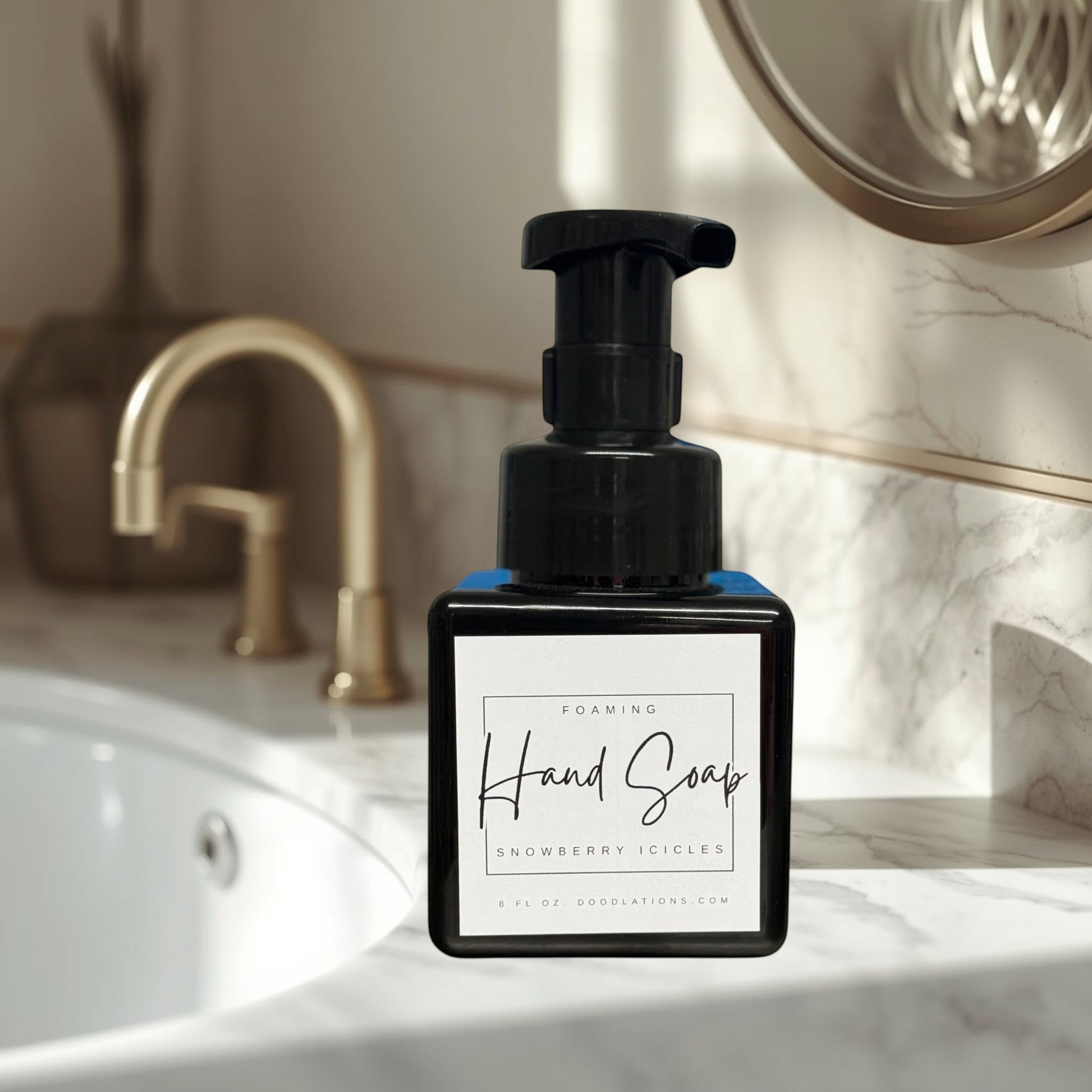 Doodlations Coffee Bar & Boutique Snowberry Icicles foaming hand soap in a black pump bottle with a white label.