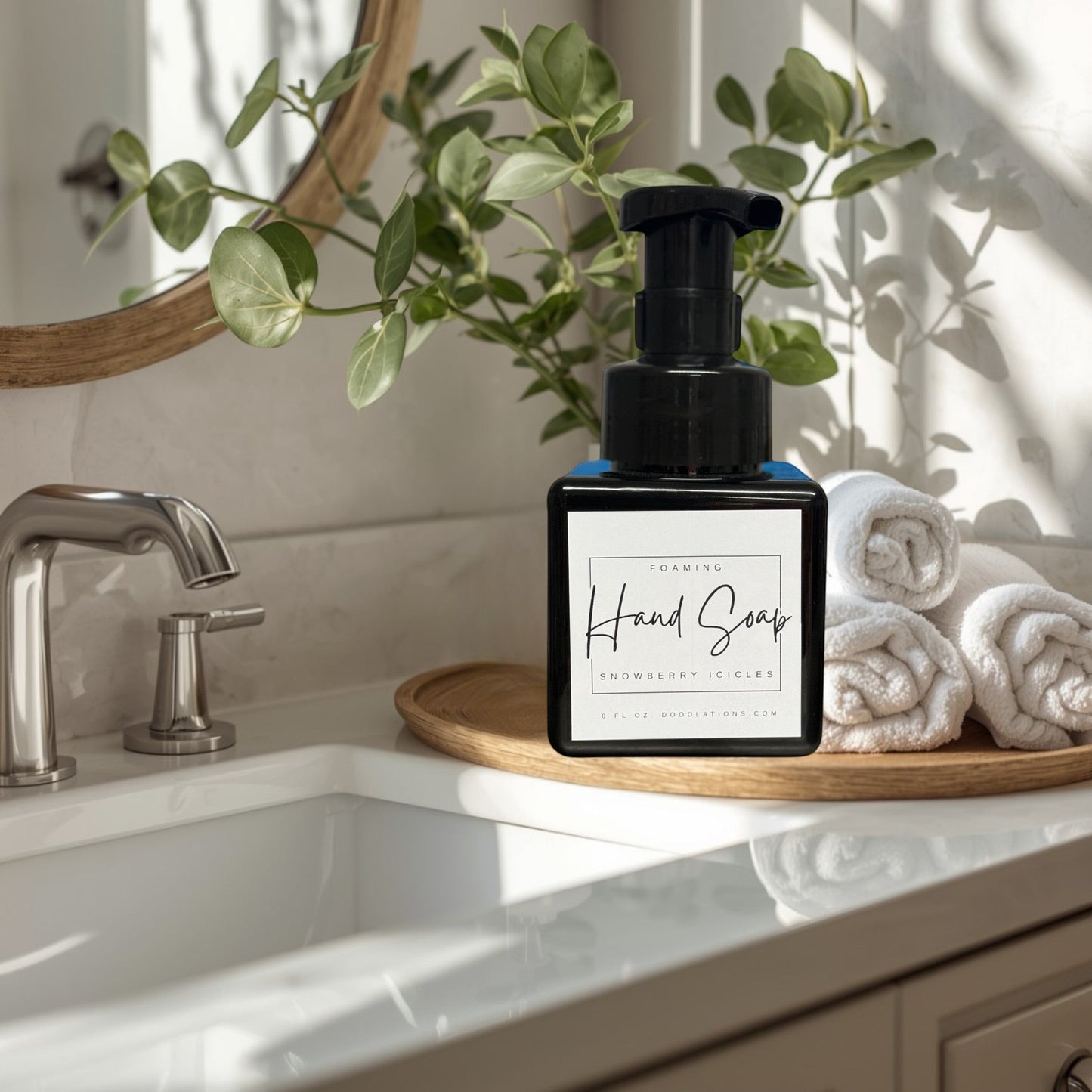Doodlations Coffee Bar & Boutique Snowberry Icicles foaming hand soap in a black pump bottle with a white label.
