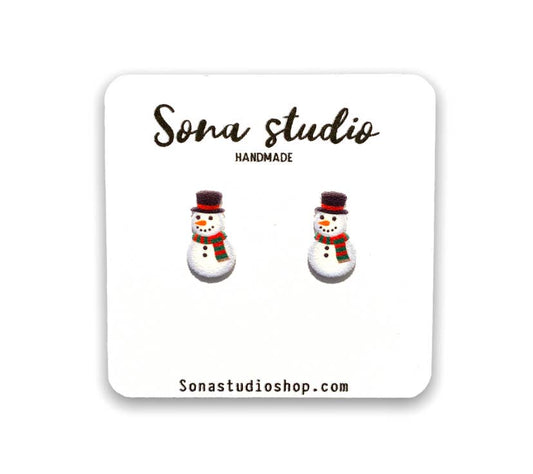Doodlations Coffee Bar & Boutique handmade snowman stud earrings with stainless steel posts on a display card
