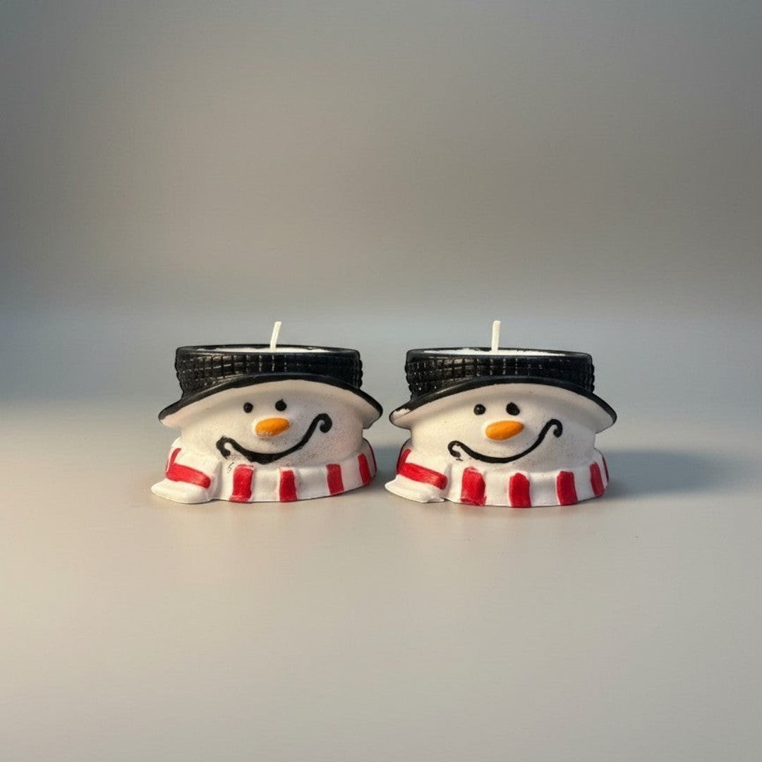 Doodlations Coffee Bar & Boutique snowman concrete tea light holder with red and white striped scarf and black hat.
