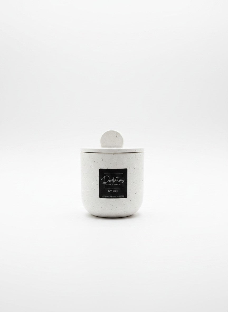 Doodlations Coffee Bar & Boutique white speckled concrete candle with a lid and My Way label on a white background.