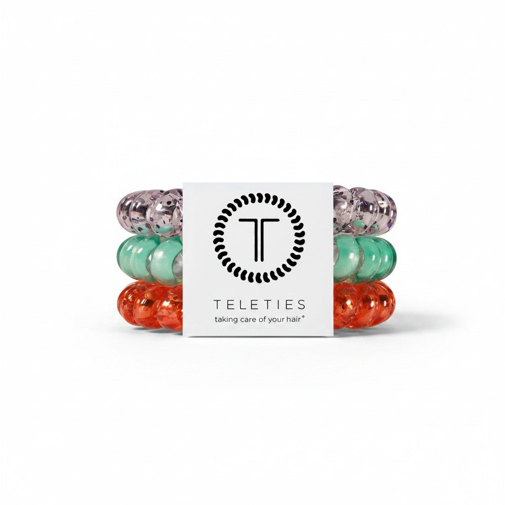 Doodlations Coffee Bar & Boutique large spiral hair coils in orange, teal, and clear, designed for a damage-free hold.