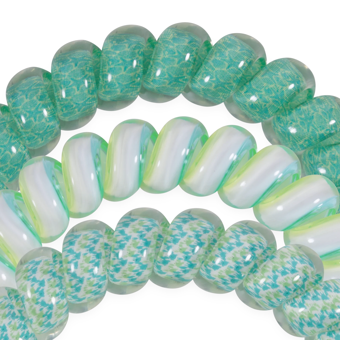 Doodlations Coffee Bar & Boutique spiral hair ties in teal and white patterns, durable and gentle on hair.