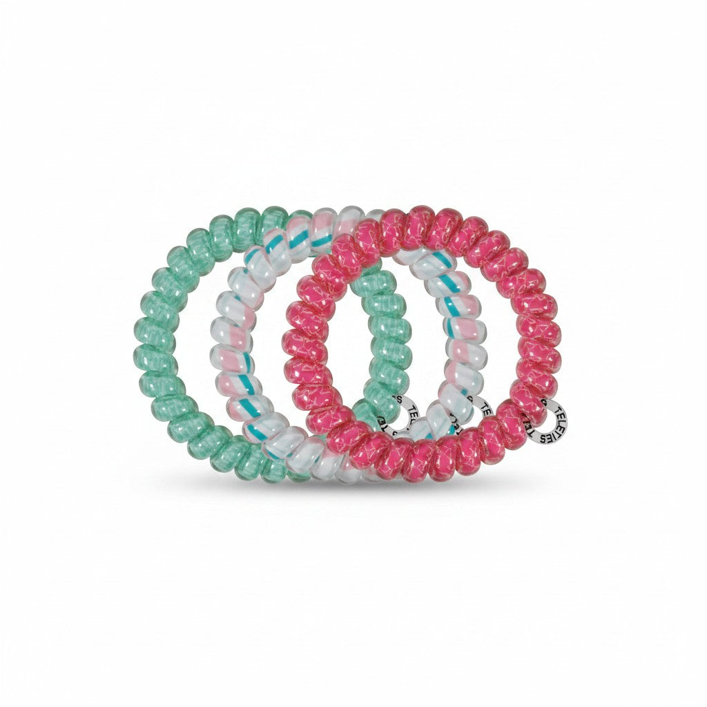 Doodlations Coffee Bar & Boutique Fin-tastic spiral hair ties in pink, green, and white, waterproof and crease-free.