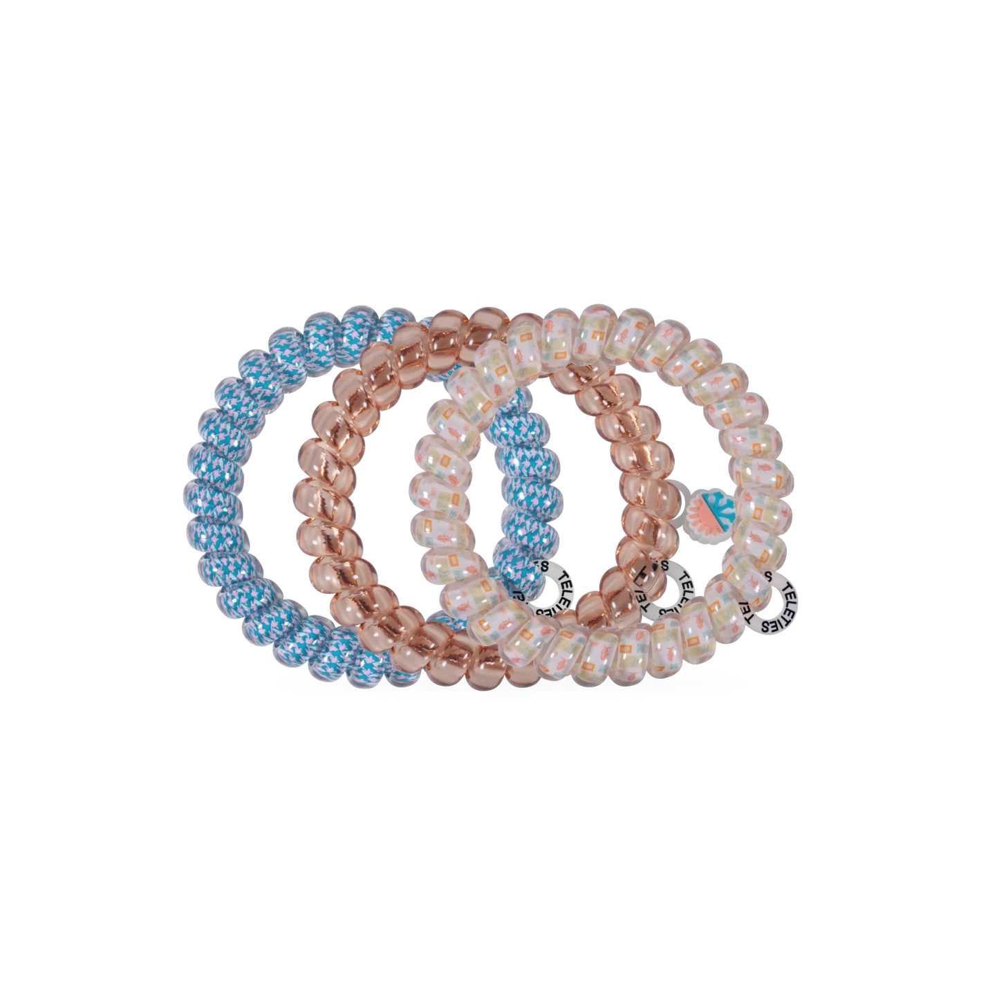 Doodlations Coffee Bar & Boutique Island Threads spiral hair ties in blue, rose gold, and patterned designs.