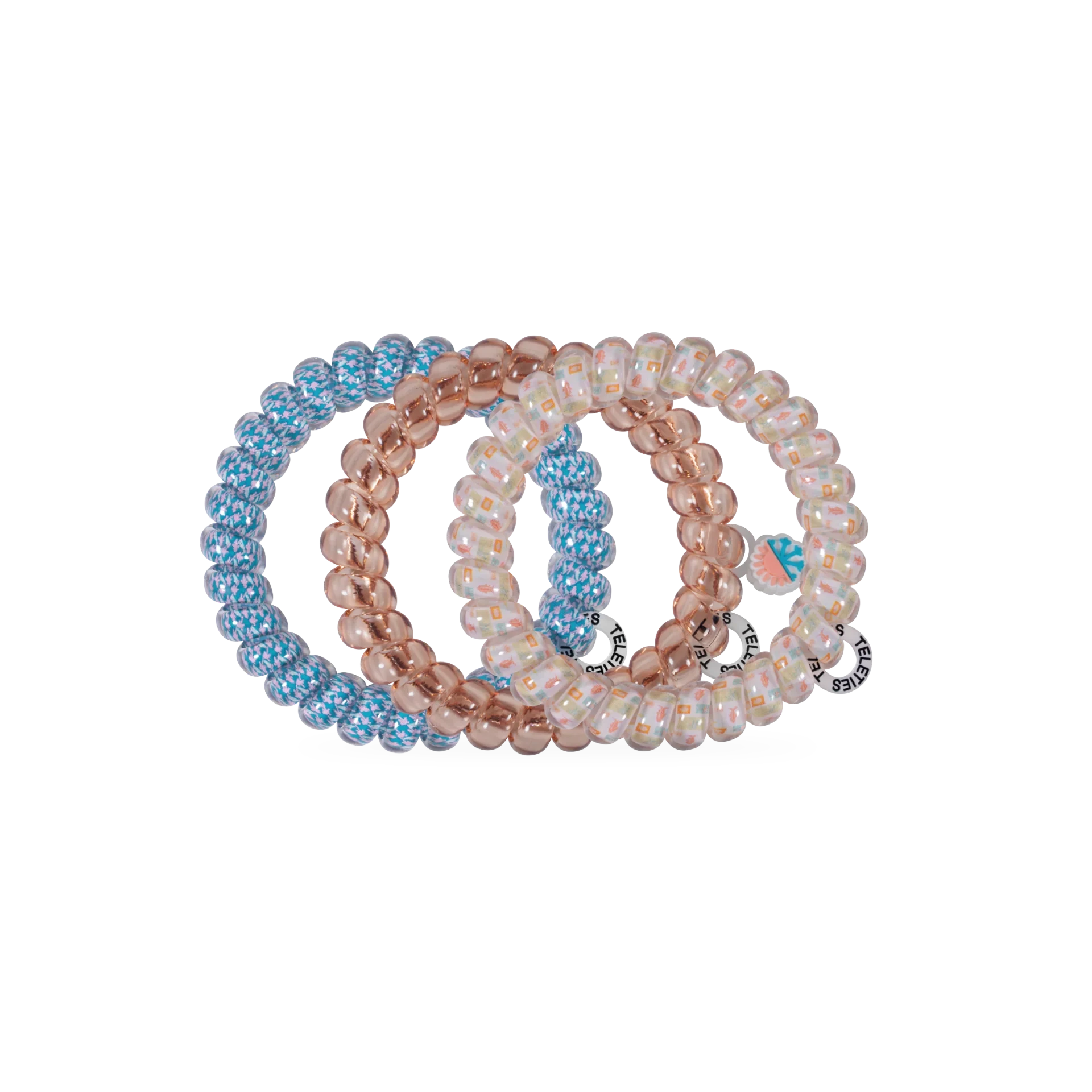Doodlations Coffee Bar & Boutique Island Threads spiral hair ties in blue, rose gold, and patterned designs.