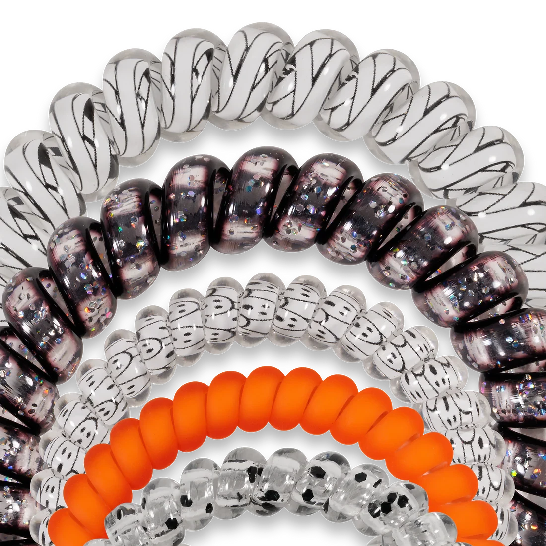 Doodlations Coffee Bar & Boutique spiral hair ties in a mix of black, white, and orange with glitter and patterns.
