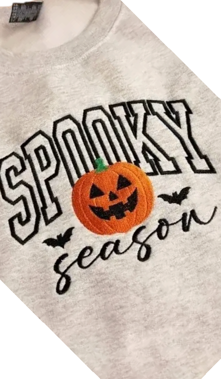 Doodlations Coffee Bar & Boutique grey unisex sweatshirt with embroidered Spooky Season pumpkin and bat design