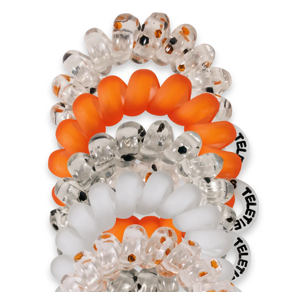 Doodlations Coffee Bar & Boutique Spooky Sparkles spiral hair ties in orange, clear, and white glitter designs.