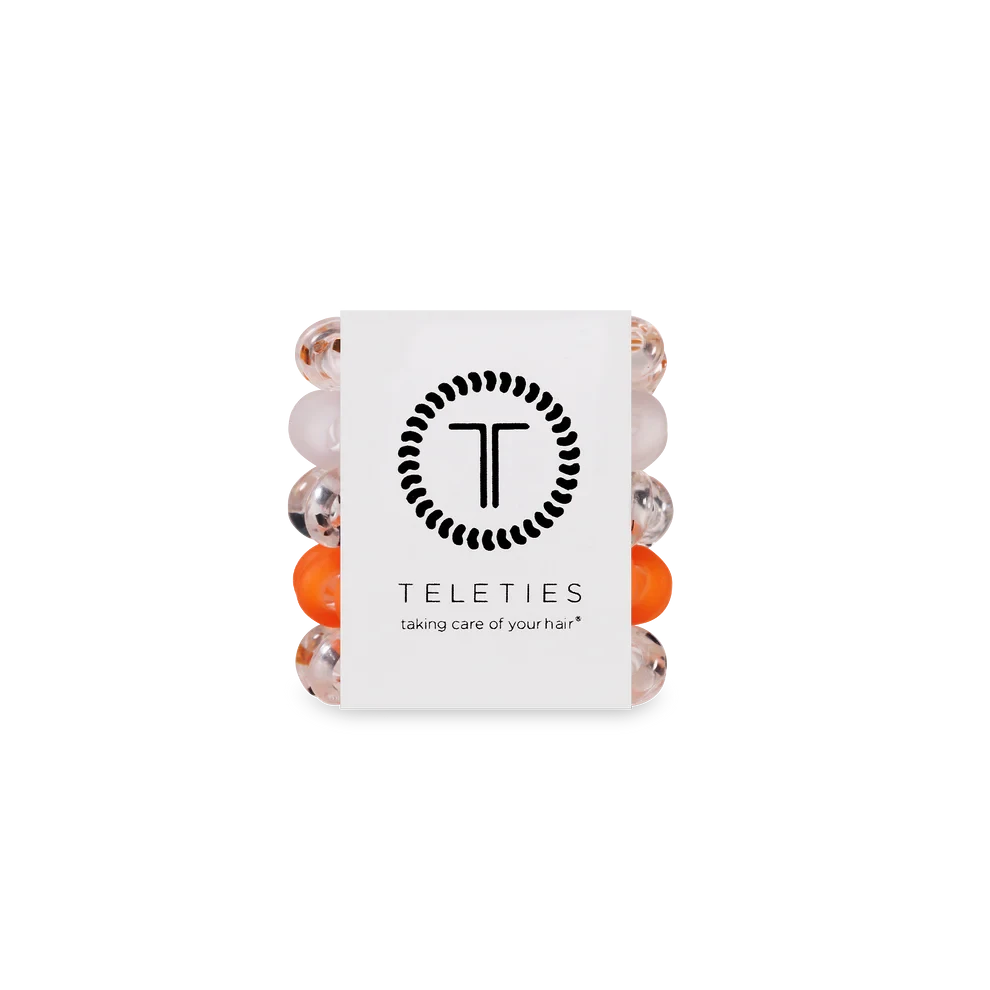 Doodlations Coffee Bar & Boutique Spooky Sparkles hair ties in black and orange, featuring a durable coil design.