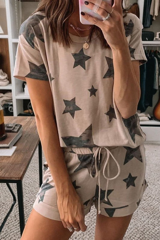 Doodlations Coffee Bar & Boutique Star Print Pajama Set. Tan two-piece set with camouflage star print, t-shirt and shorts.