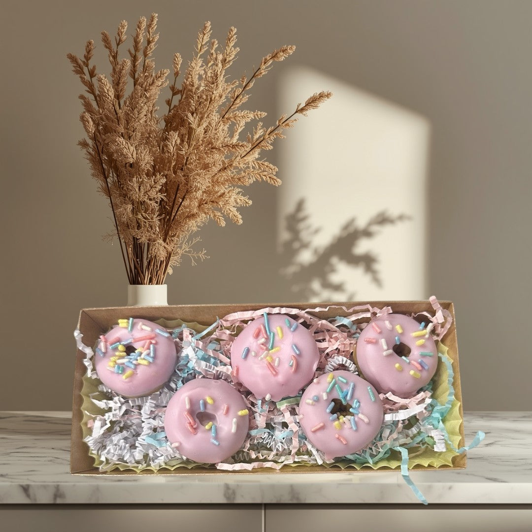 Doodlations Coffee Bar & Boutique pink strawberry glazed donut wax melts with colorful sprinkles in a gift box.