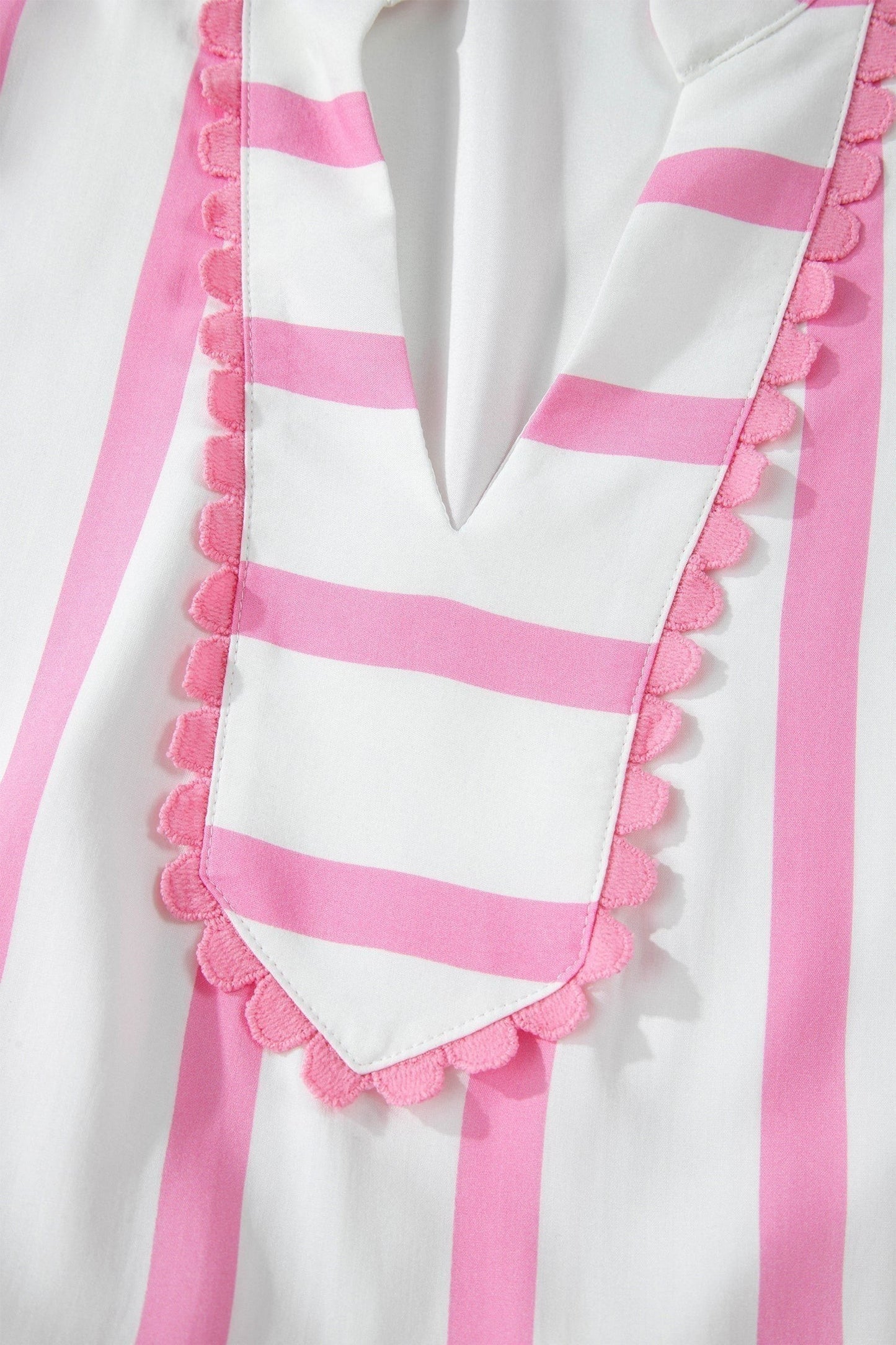 Doodlations Coffee Bar & Boutique white and pink striped tunic with V-neck and scalloped trim. Puffed sleeves.