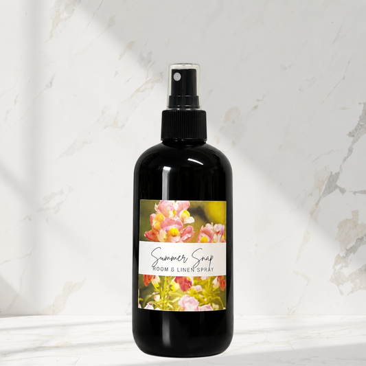 Doodlations Coffee Bar & Boutique Summer Snap room and linen spray in a black bottle with a floral label
