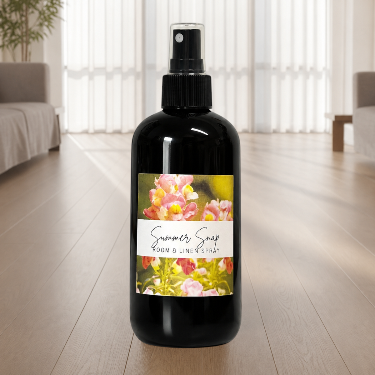 Doodlations Coffee Bar & Boutique Summer Snap room and linen spray in a black bottle with a floral label