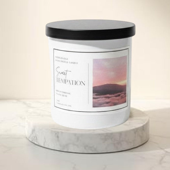 Doodlations Coffee Bar & Boutique Sweet Temptation luxury boutique candle in a minimalist white vessel with a black lid. Tropical fruity fragrance.