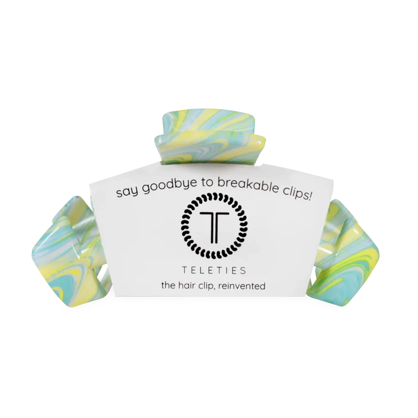 Doodlations Coffee Bar & Boutique Classic By the Sea Shore claw hair clip with a blue, yellow, and white swirl pattern