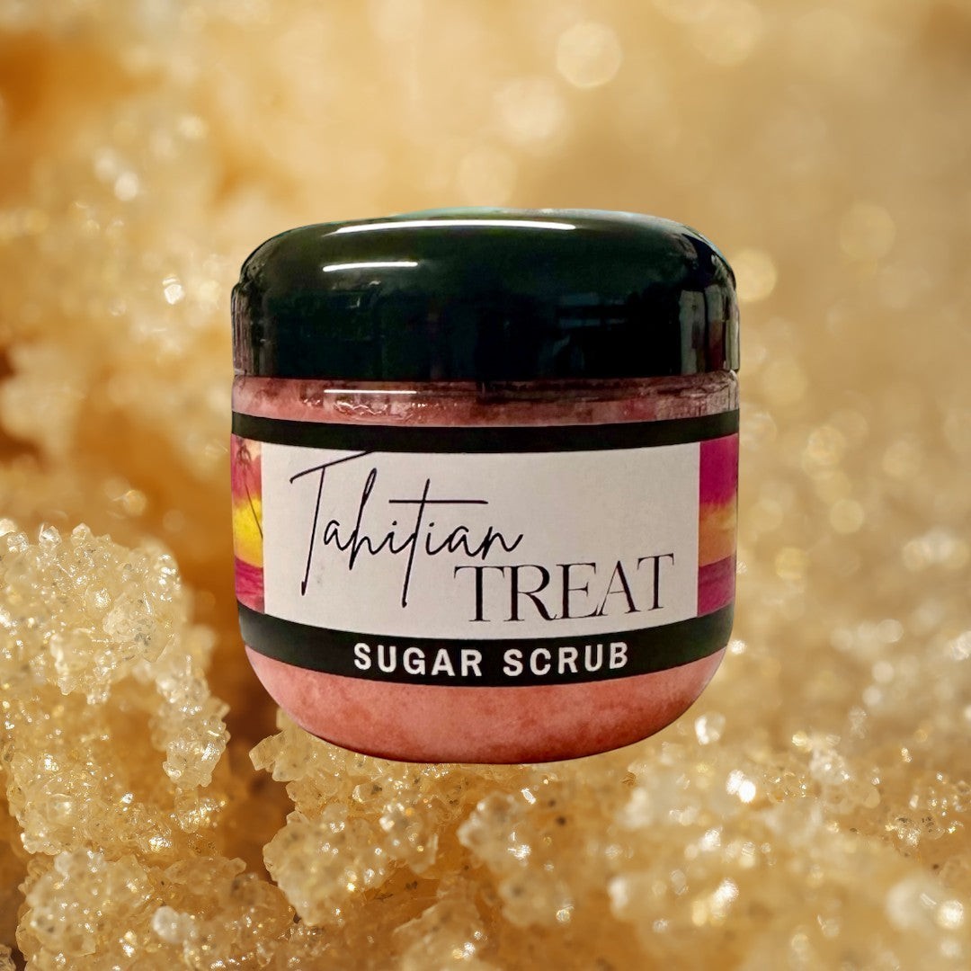 Doodlations Coffee Bar & Boutique Tahitian Treat Sugar Scrub in a clear jar with a black lid, pink scrub, and tropical sunset label.