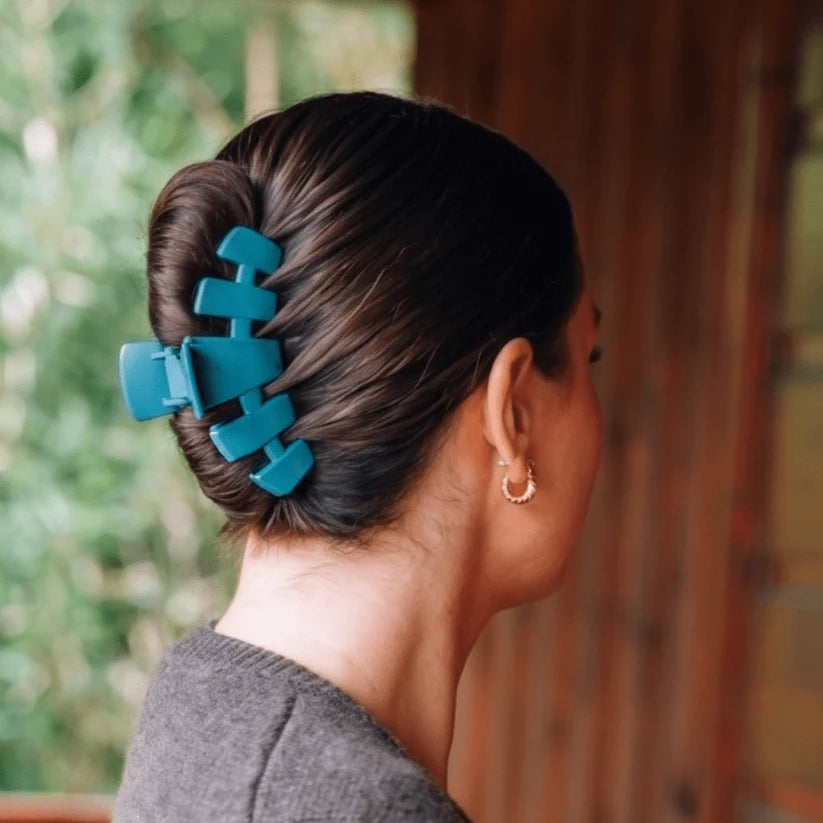 Doodlations Coffee Bar & Boutique teal Teleties classic claw clip holding a woman's hair in an elegant updo