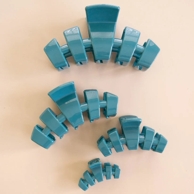 Doodlations Coffee Bar & Boutique Teleties Classic Teal claw clips in four different sizes on a neutral background