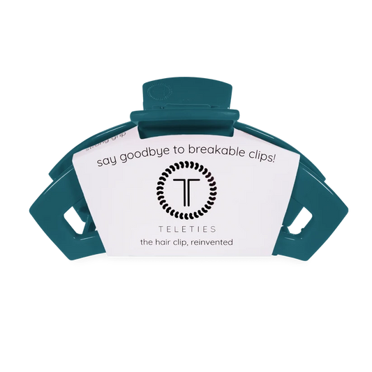 Doodlations Coffee Bar & Boutique Teleties teal hair claw clip with a strong grip design on branded display card.