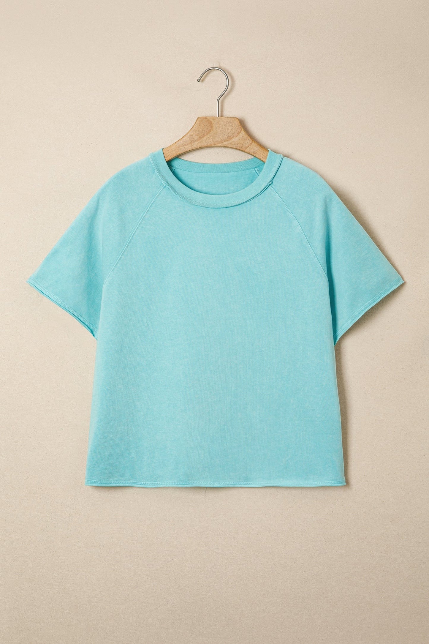 Doodlations Coffee Bar & Boutique teal mineral wash cotton blend tee with raw edge hem and sleeves.