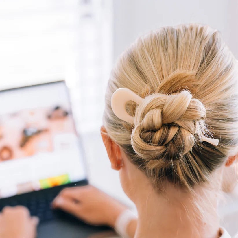 Doodlations Coffee Bar & Boutique Teleties French hair pin in coconut white securing a blonde woman's hair bun