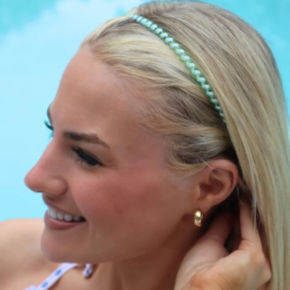 Doodlations Coffee Bar & Boutique Teleties headband in light green worn by a blonde woman by a pool