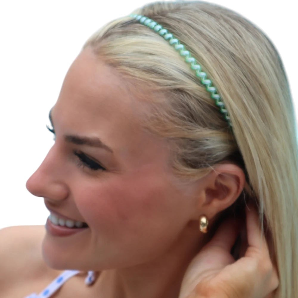 Doodlations Coffee Bar & Boutique Teleties headband in light green worn by a blonde woman by a pool