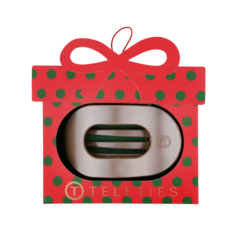 Doodlations Coffee Bar & Boutique Teleties flat round hair clip inside a festive red and green polka dot ornament box.